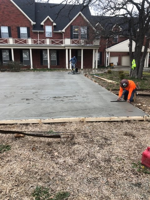First section of new concrete driveway poured. 