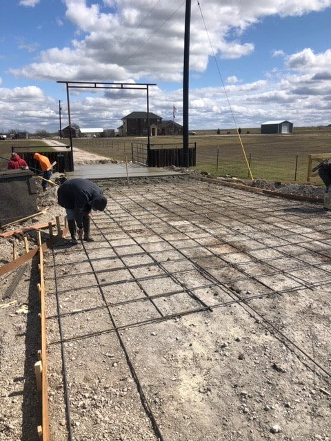 workers setting the rebar for main drive entry pouring