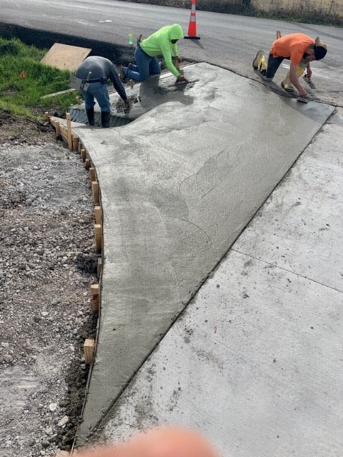 edge of driveway entry extension freshly poured
