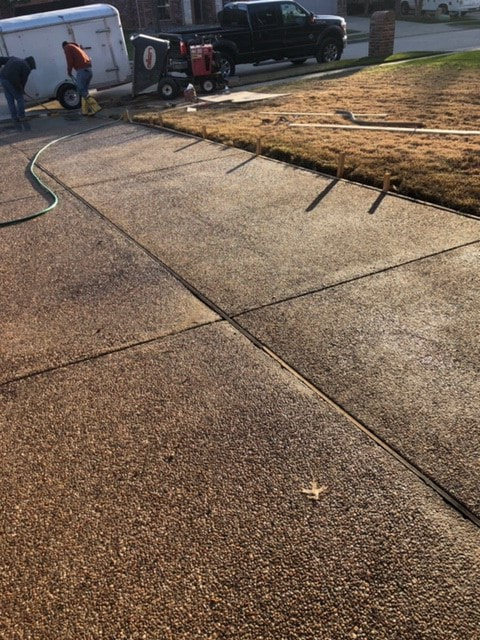 Another view of concrete driveway curing in Corinth, TX